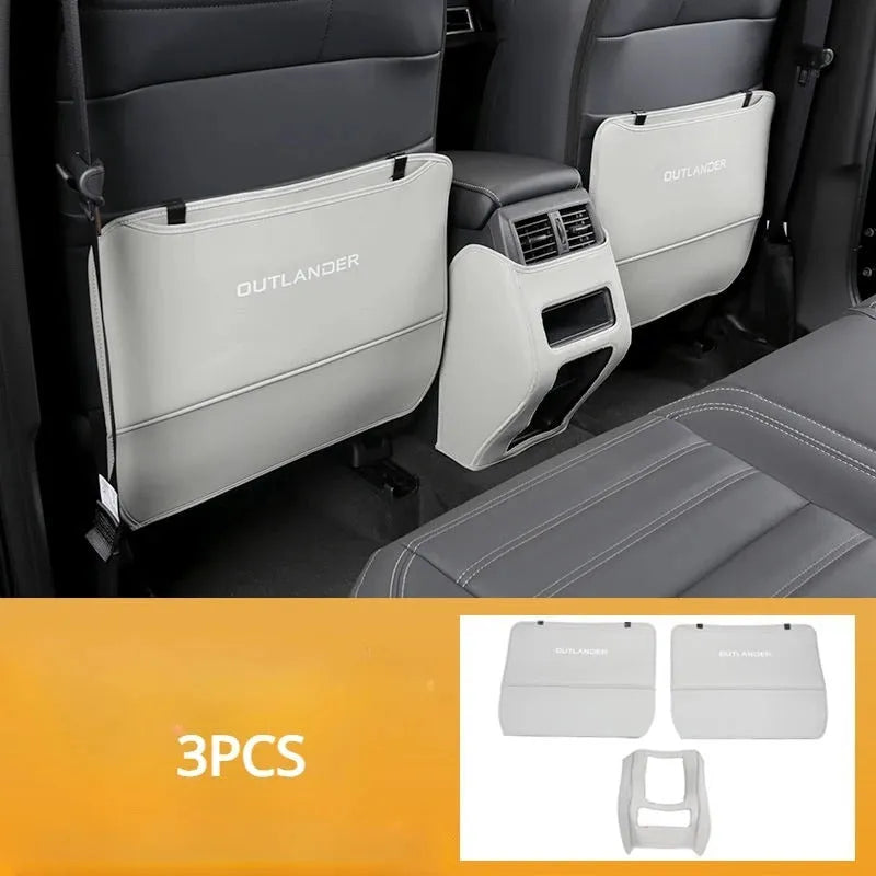 Set of three leather anti-kick protection pads for a Mitsubishi Outlander car interior.