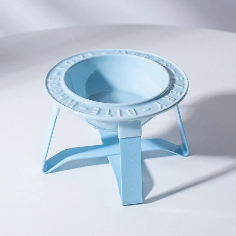 Ceramic cat bowl with iron anti-tip frame in blue colour with silicone pad