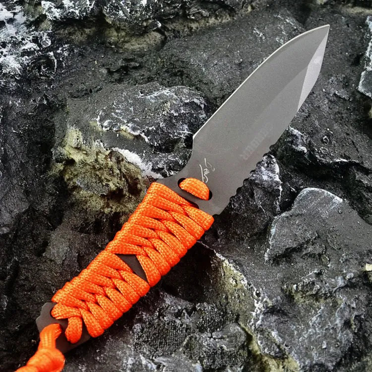 Outdoor survival knife with straight blade, rope-bound handle, and black ABS sheath on grey background