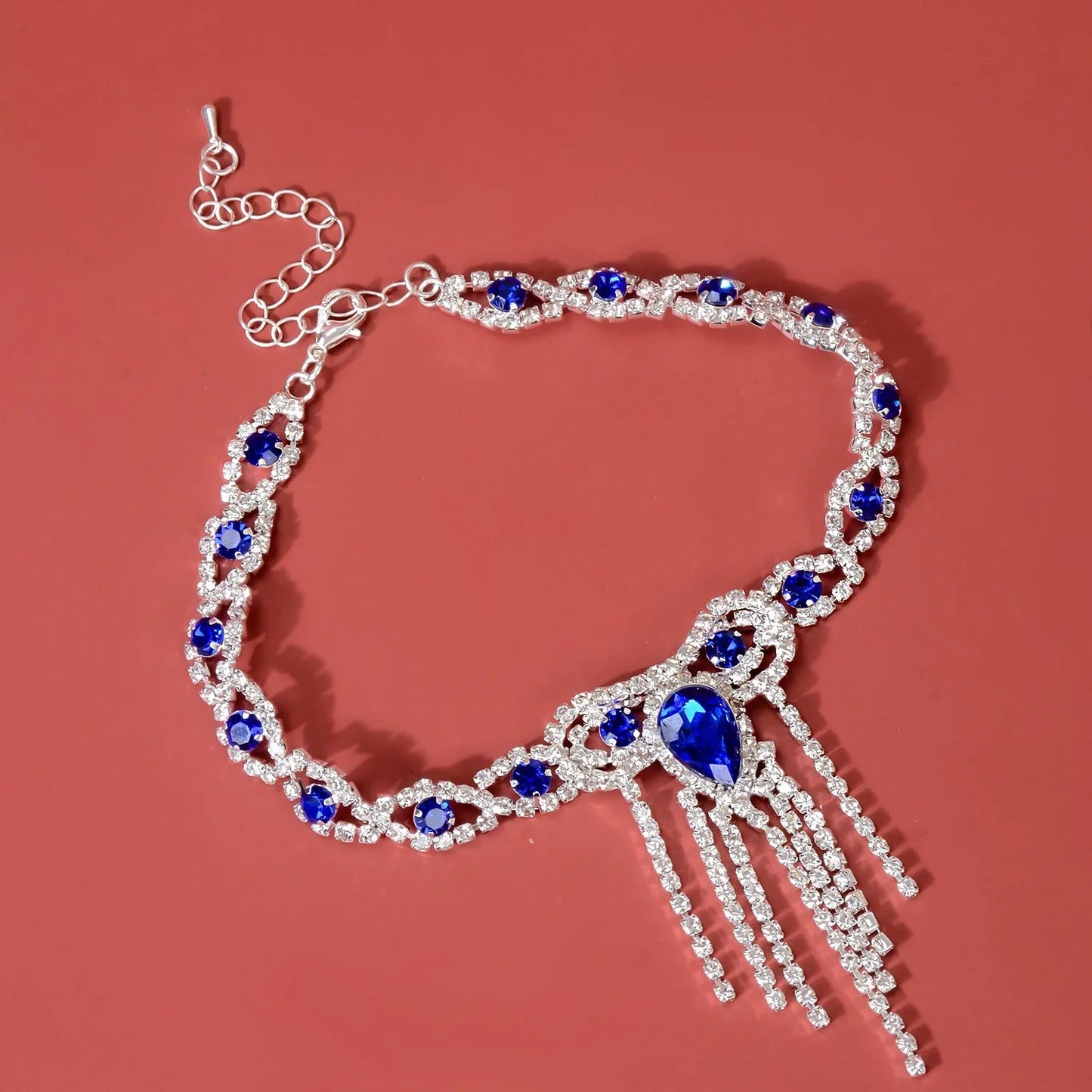 Blue rhinestone tassel anklet with gold-plated accents, perfect for women's fashion accessories.