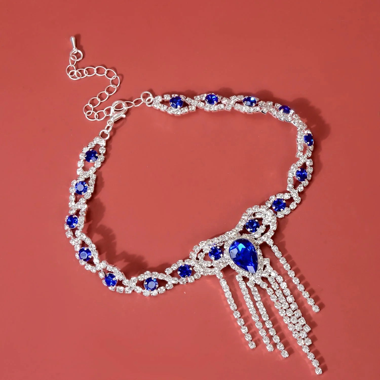 Blue rhinestone tassel anklet with gold-plated accents, perfect for women's fashion accessories.