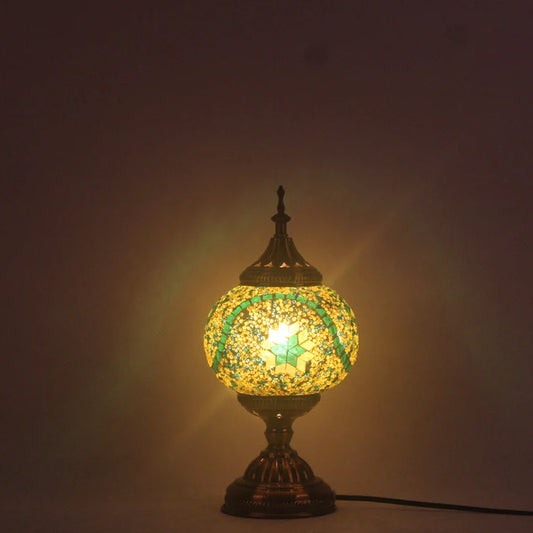 Glass table lamp with 150mm diameter shade and 330cm cord on wooden surface