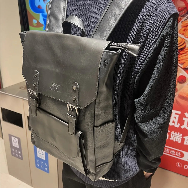 Unisex backpack college style large capacity travel backpack made from PU material in black, dark brown, or light brown, featuring a breathable design suitable for business travel or daily use.