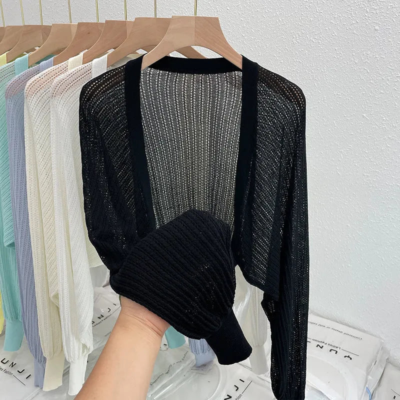 Long sleeve polyester blouse with lantern sleeves and hollow detail in apricot colour.