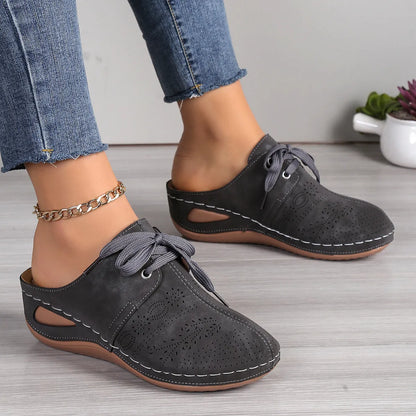 Women's summer lace-up slippers with hollow-out wedge design in black, suede upper, and rubber sole