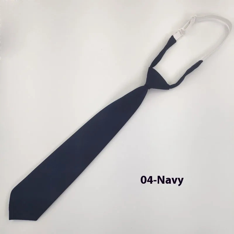 Men's navy blue cotton bow tie with arrow style shape on a white background.