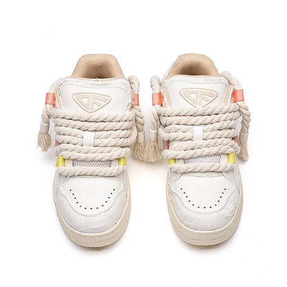 Creamy white old damage retro skate shoes with lace-up front, platform heel, and round toe.