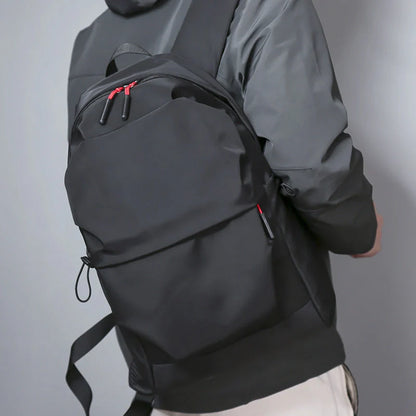 Sleek and durable nylon backpack with spacious compartments for everyday use.