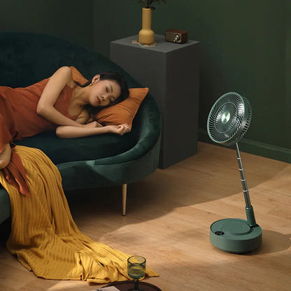 Green and white storage floor electric fan extended to vertical position with remote control