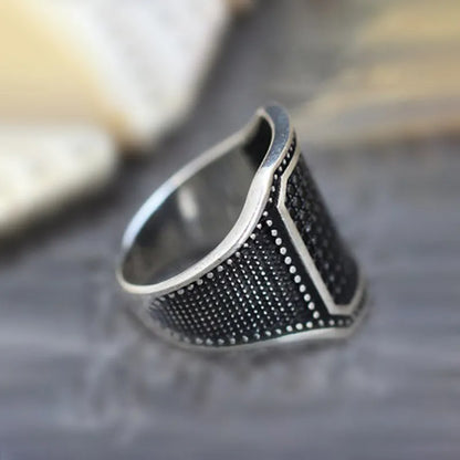 Black alloy ring with copper inlays and zircon accents, shown in a unisex style on a hand, sizes 7-13 available