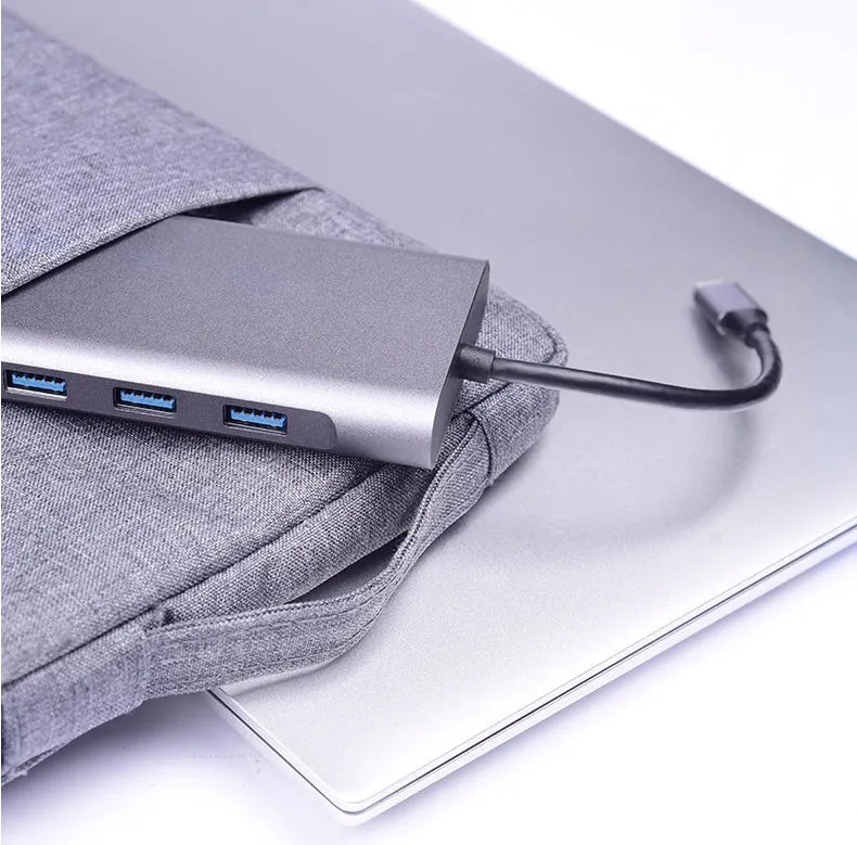 10-in-1 Apple MacBook docking hub with power bank functionality showing multiple USB ports