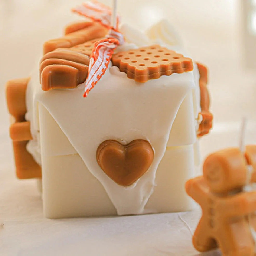 Homemade gingerbread man Christmas scented candles in block shape with six fragrance options