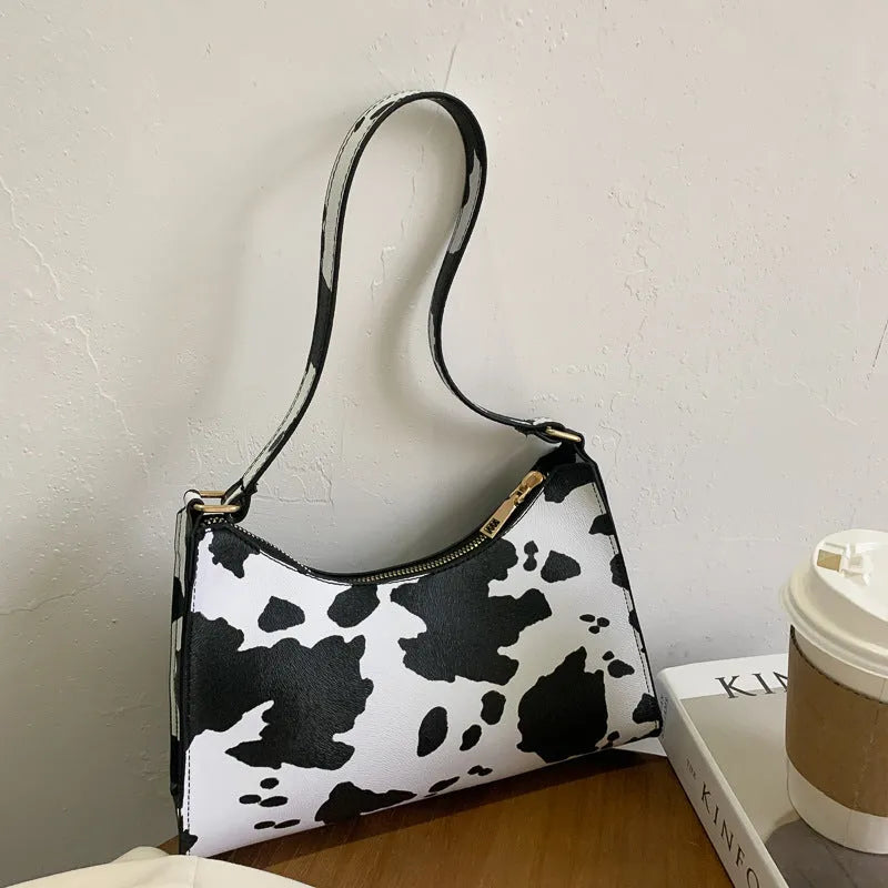 Small square women's underarm bag in multiple colour and pattern options including leopard print