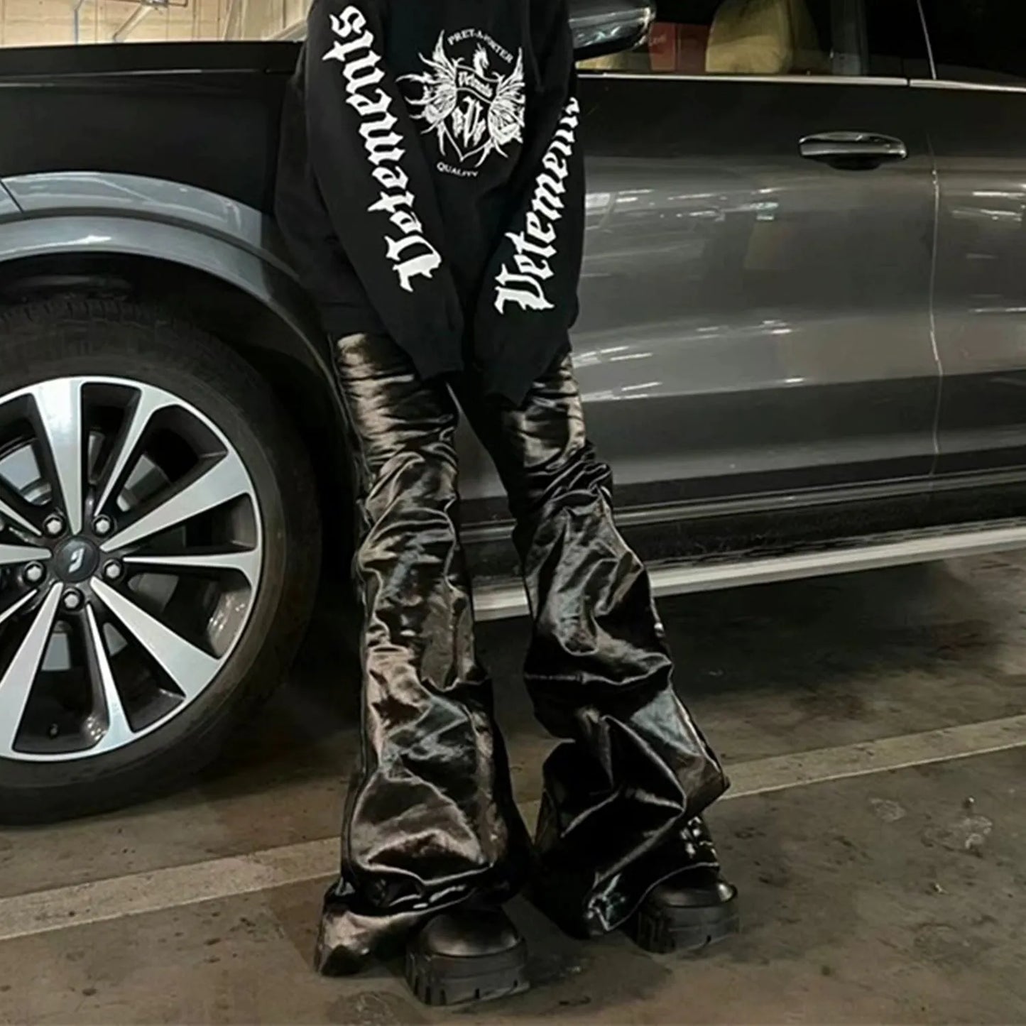 Black patent leather finish skinny jeans with straight leg cut on cotton denim