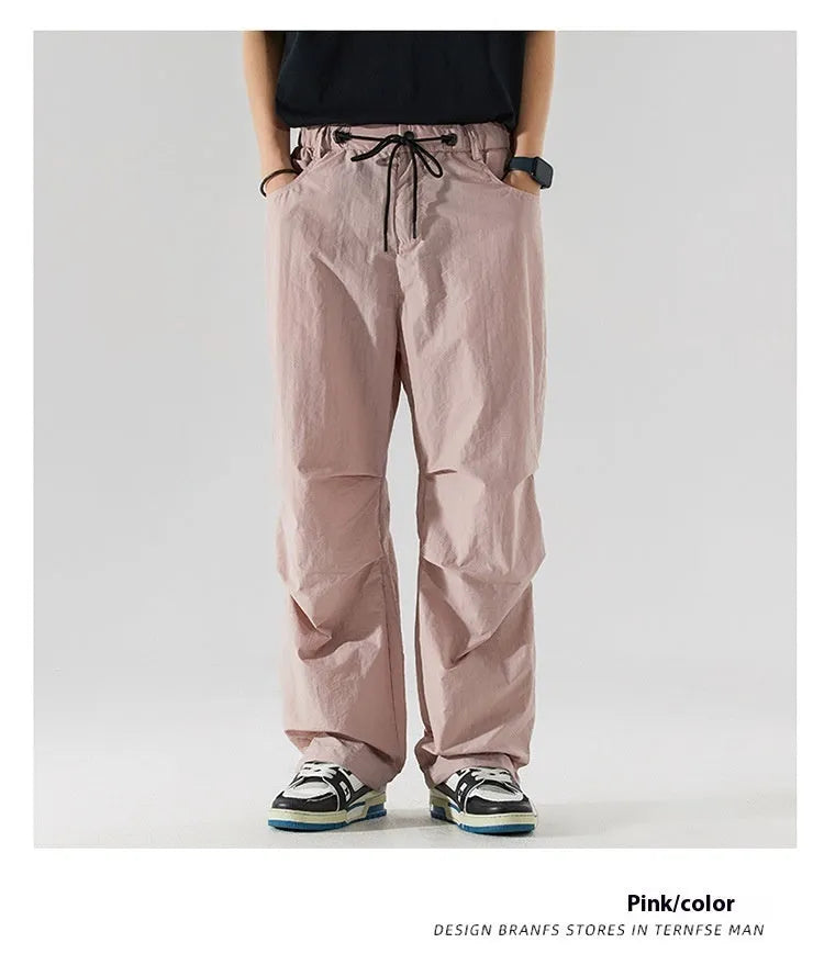 Men's loose straight-leg casual pants in thin ice silk fabric shown in black colour