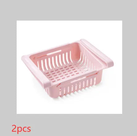 Plastic telescopic refrigerator storage basket in apricot colour, showing multiple compartments for organisation.