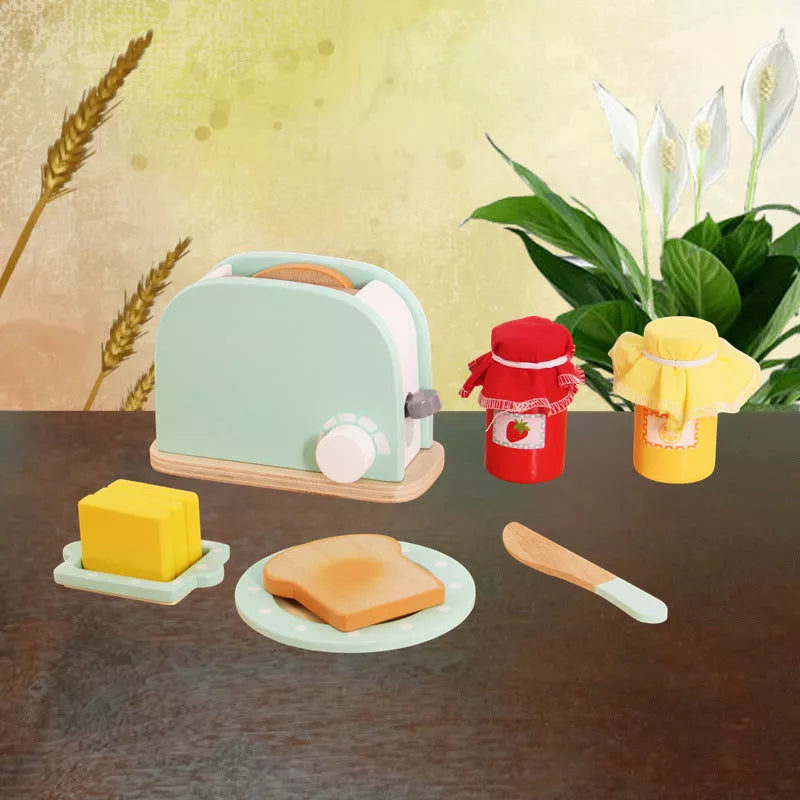 Wooden children's playhouse toys with Maca Dragon design, including kitchen-themed pieces for imaginative play