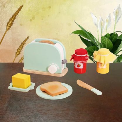 Wooden children's playhouse toys with Maca Dragon design, including kitchen-themed pieces for imaginative play