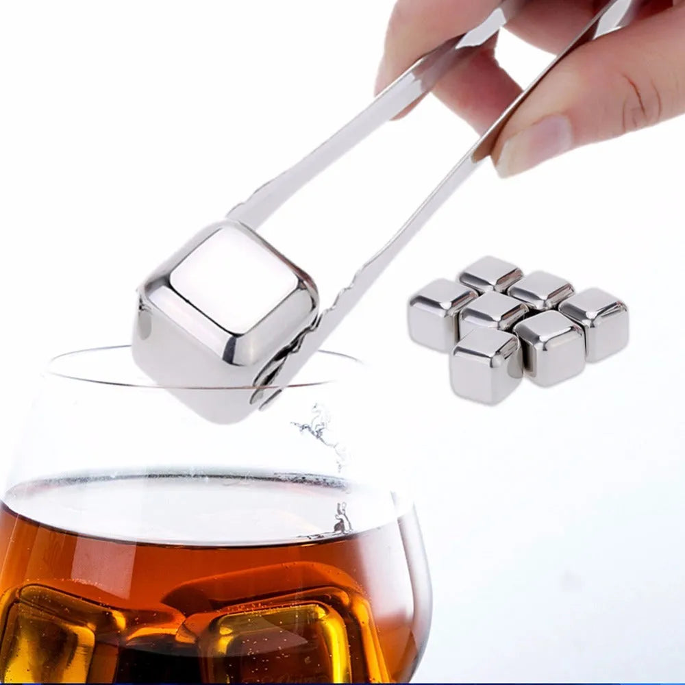 Set of eight stainless steel whiskey cooling stones with metal clip in plastic storage container