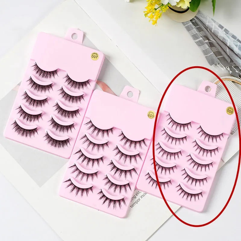 Set of manga-style false eyelashes in natural wispy styles 007, 008, and 009 on plastic black terrier