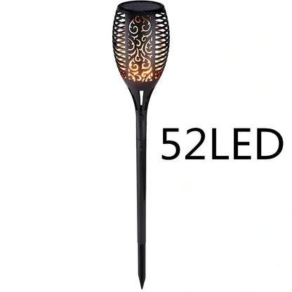 Solar garden LED light with flame flickering effect on stainless steel stake in outdoor setting