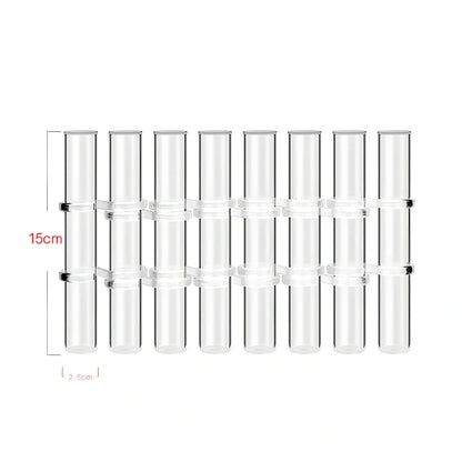Clear glass hinged test tube vase with plants in curved arrangement