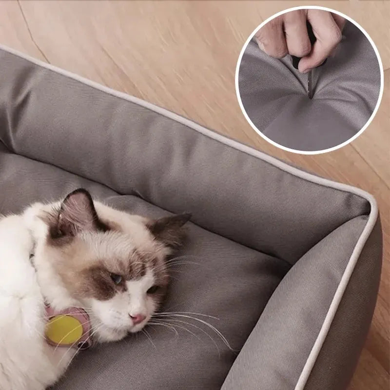 Grey waterproof Oxford cloth dog sofa bed on a wooden floor