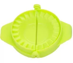 Plastic dumpling maker device in blue, green, and white for quick, uniform dumplings