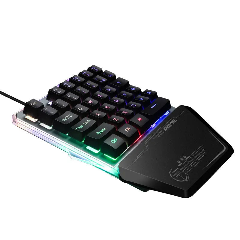 Black one-handed keyboard with RGB backlight and 1.8-metre USB cable on a desk