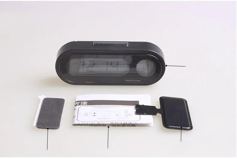 Black electronic car clock thermometer with LED display showing time and temperature, mounted on adjustable bracket