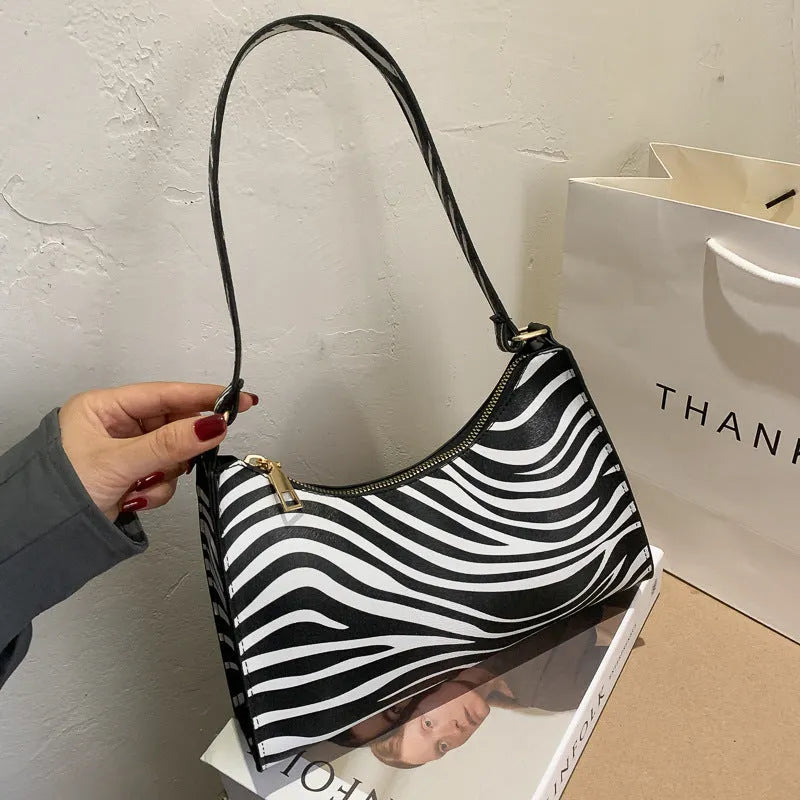 Small square women's underarm bag in multiple colour and pattern options including leopard print