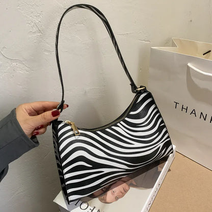 Small square women's underarm bag in multiple colour and pattern options including leopard print