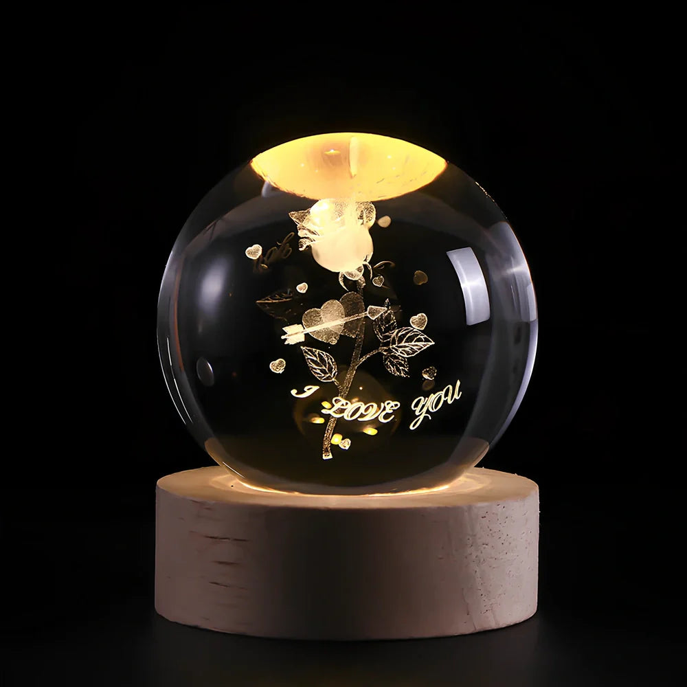 3D crystal ball night light projecting solar system pattern on wooden base with astronaut figurine