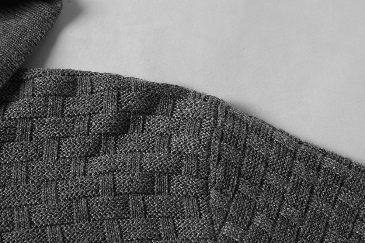 Man wearing a cotton-polyester blend hooded sweatshirt in grey, showing the front design and hood.