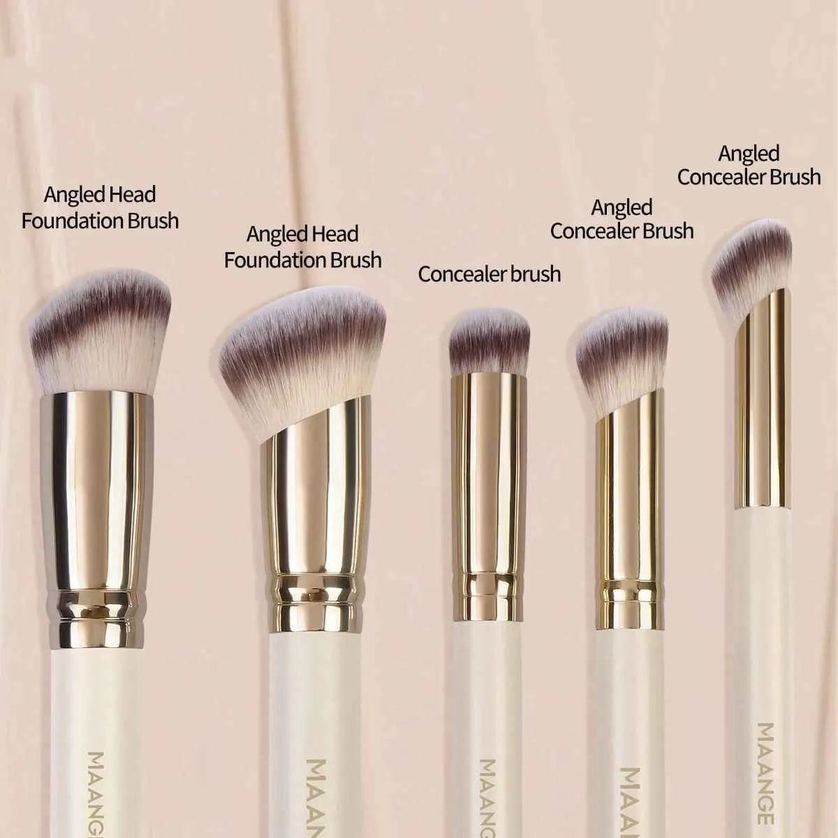 Apricot-coloured angled blush makeup brush and kabuki brush from a 5-piece synthetic bristle set.