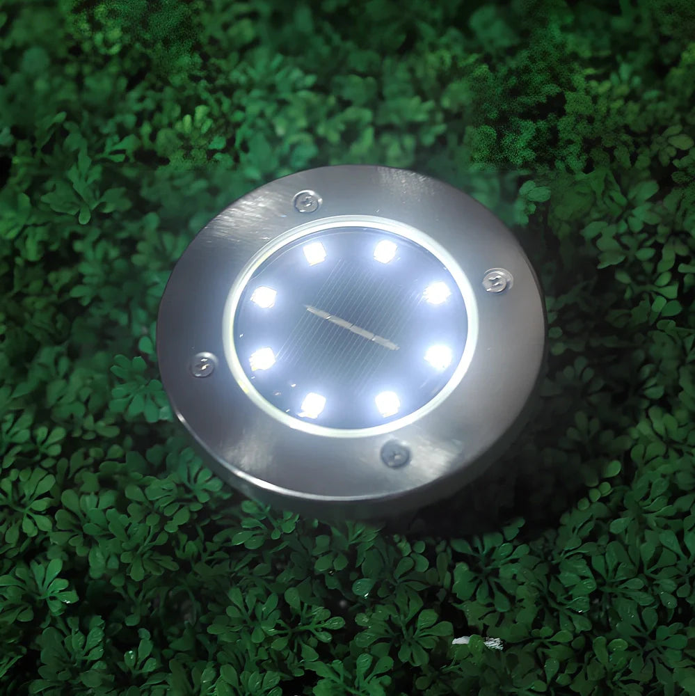 Stainless steel solar garden light with LED illumination for outdoor landscape lighting