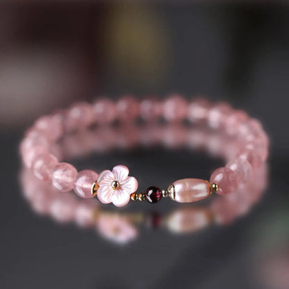 Strawberry quartz peach blossom crystal bracelet for women showing floral design.
