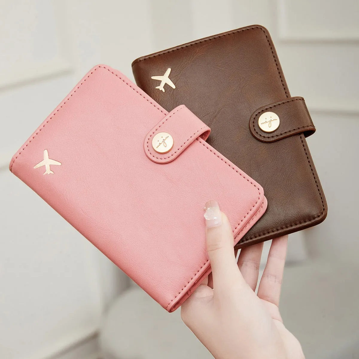 Simple PU leather passport holder in sapphire blue with visible sewing lines, showing card slots and RFID protection.