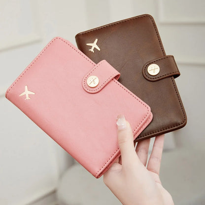Simple PU leather passport holder in sapphire blue with visible sewing lines, showing card slots and RFID protection.