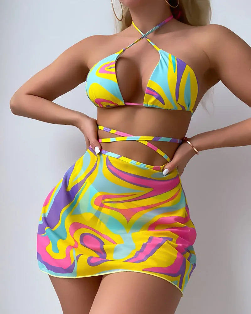 Yellow striped halter neck swimsuit with lace-up front and matching high-waisted skirt and shorts