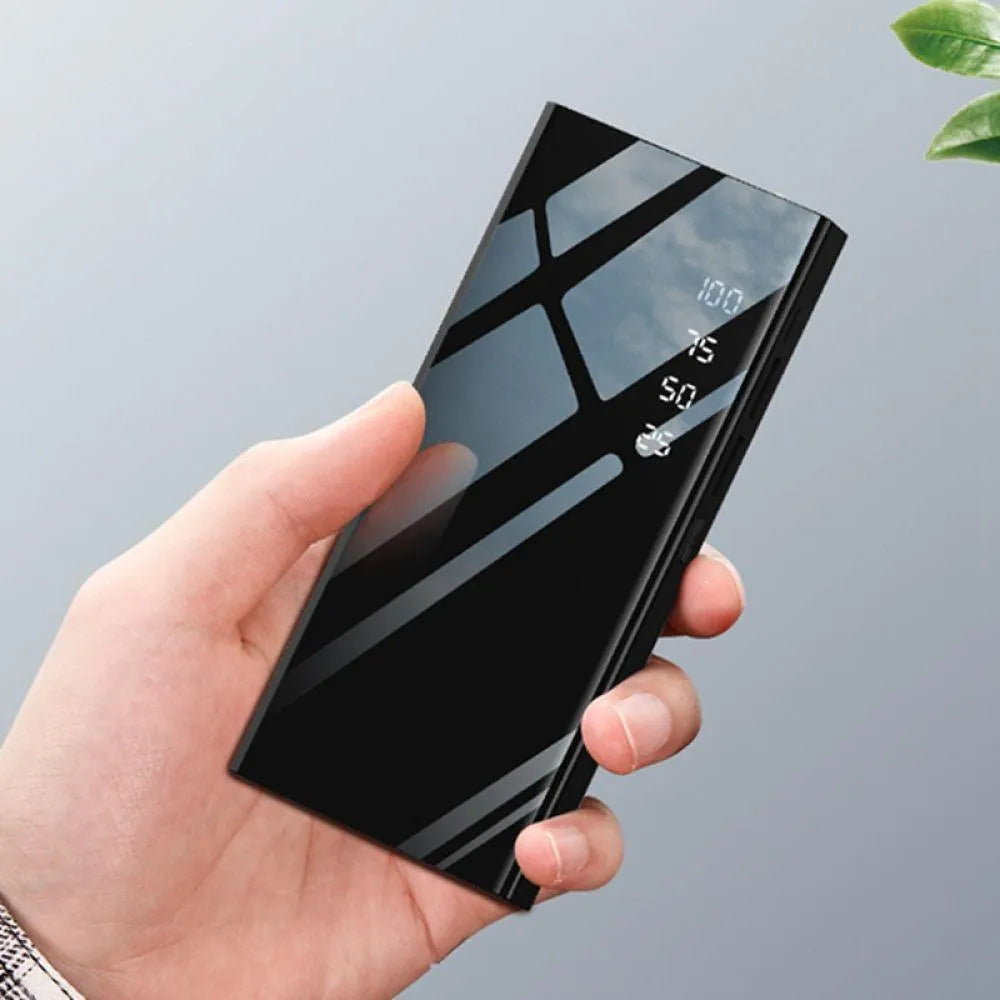 Black 20000mAh power bank with LCD display showing battery percentage and dual USB ports