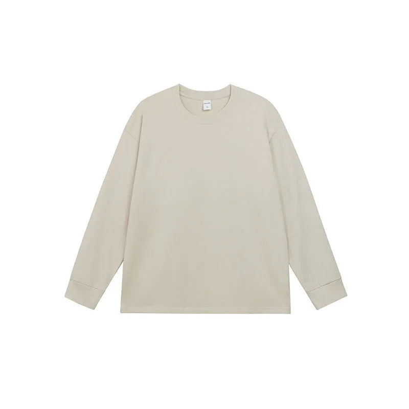Man wearing a simple solid colour long sleeve cotton t-shirt in a loose, casual fit.