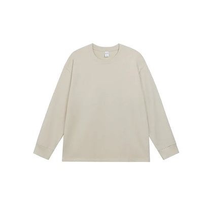 Man wearing a simple solid colour long sleeve cotton t-shirt in a loose, casual fit.