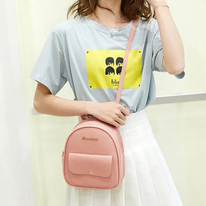 Small women's shoulder backpack in solid colour with zipper closure, dimensions 18.5cm x 8cm x 21cm