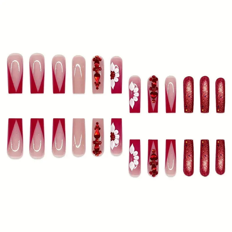 Sweet floral pattern press-on nails with red diamond accents in a long European Square shape.