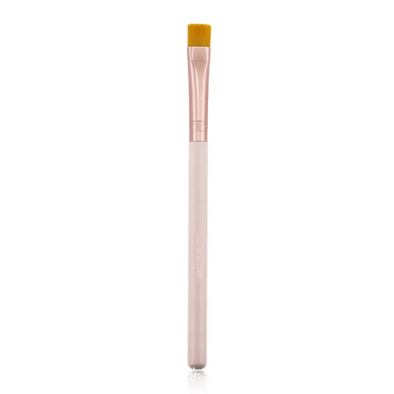 26 pink makeup brushes with wool bristles and wooden handles arranged in a PU zip bag.