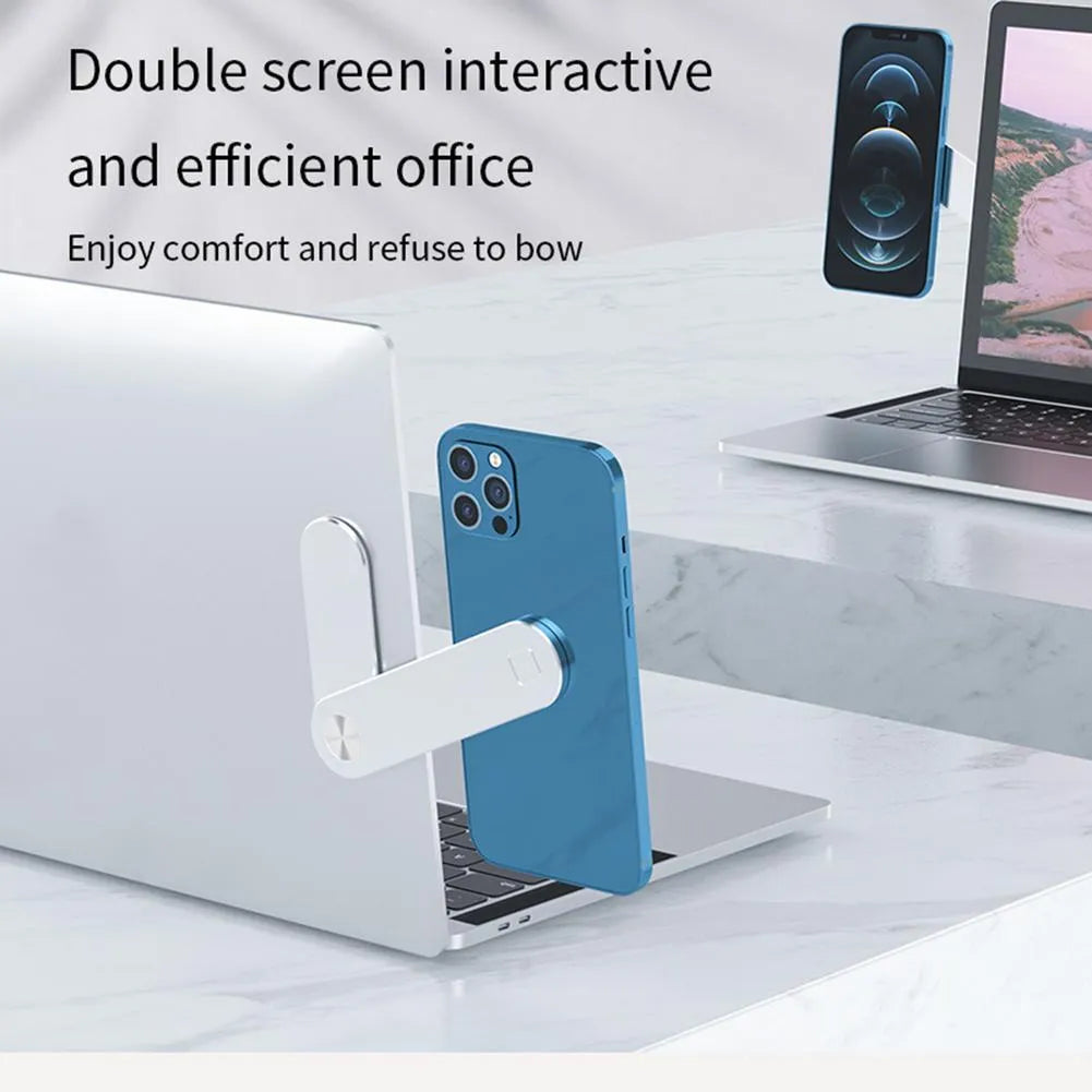 Black laptop phone holder with magnetic clip mounted on silver laptop, showing smartphone in adjustable bracket