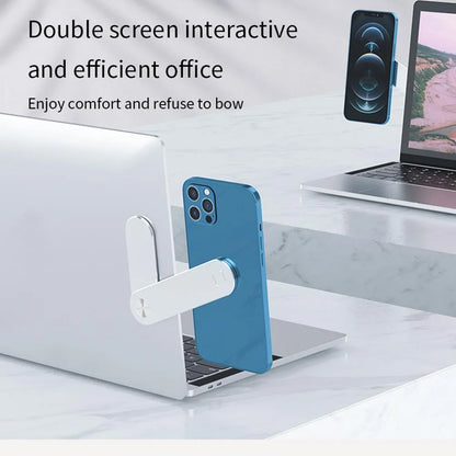 Black laptop phone holder with magnetic clip mounted on silver laptop, showing smartphone in adjustable bracket