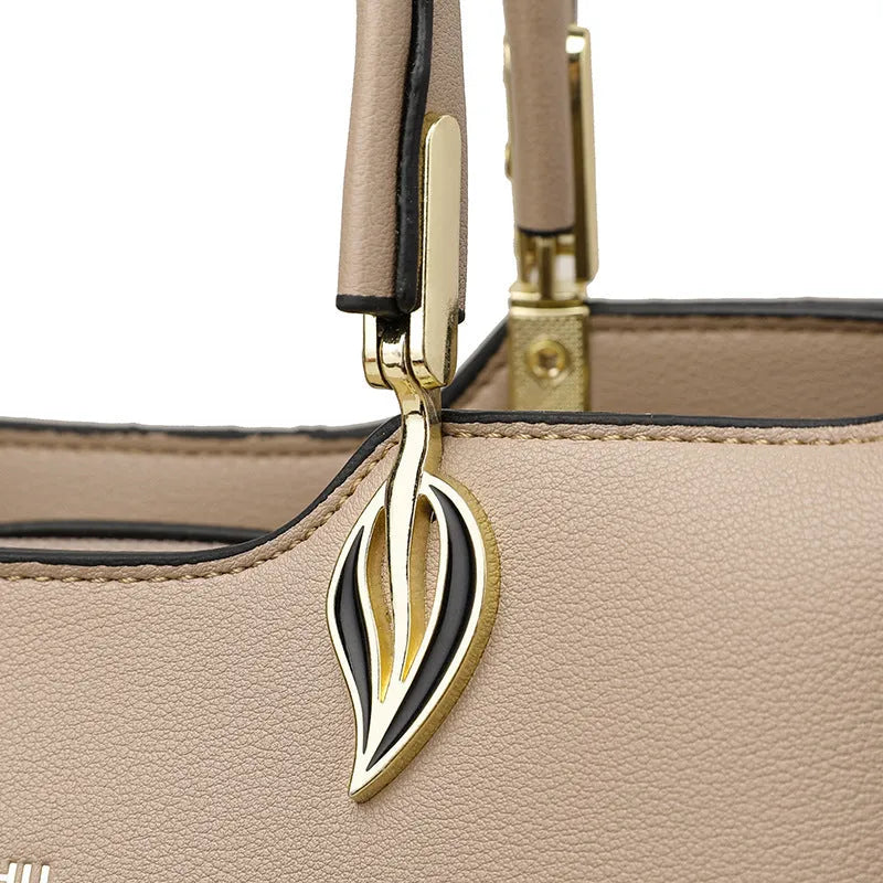 Women's black PU leather messenger bag with multi-layer shoulder strap and sewing thread detailing.