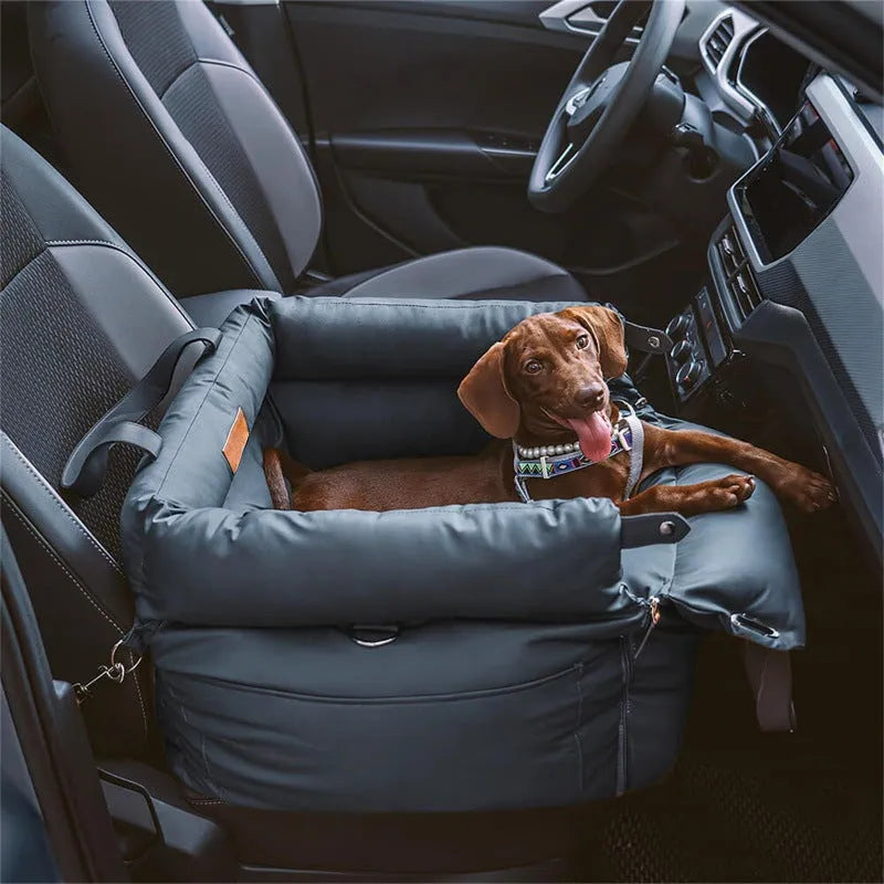 Green waterproof dog car nest with a removable cover, shown placed in a vehicle boot.